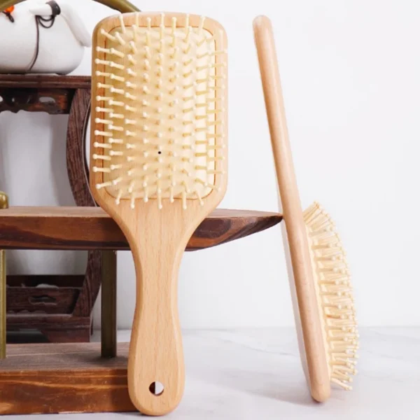 Wooden hair brush for scalp care, anti-hair loss, and massage.